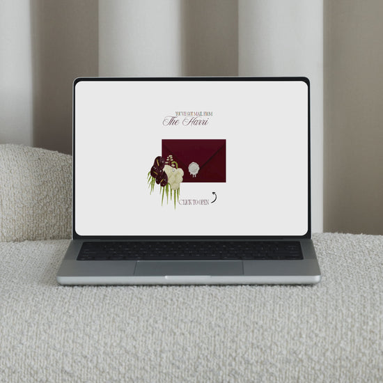 Interactive video showing a luxury burgundy wedding envelope opening animation to reveal a save the date website.